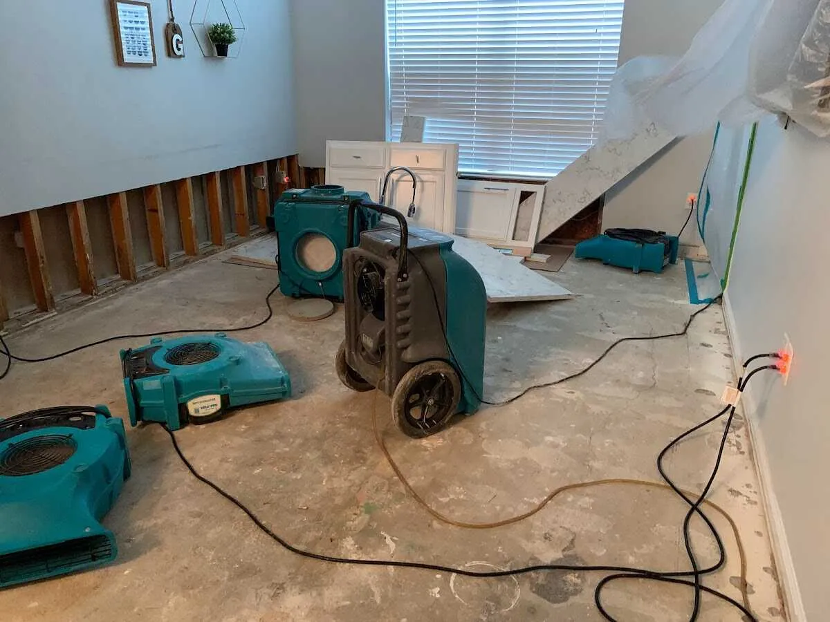 Dehumidifier in flood-cut room for Water Damage Restoration in Lyons